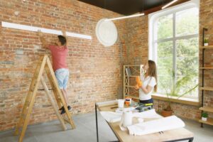 Young couple doing apartment repair together themselves